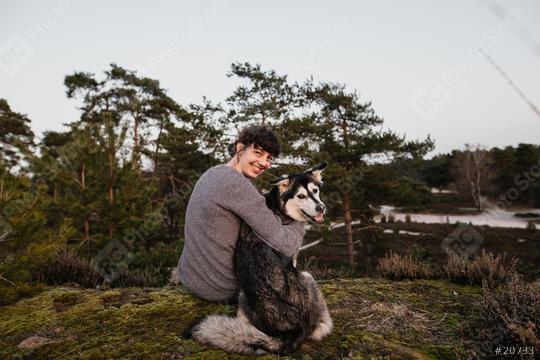Young woman and dog are having fun and laughing. Looking at the camera. The woman and the husky enjoy the view in a beautiful landscape. Hugging at sunset.  : Stock Photo or Stock Video Download rcfotostock photos, images and assets rcfotostock | RC Photo Stock.: