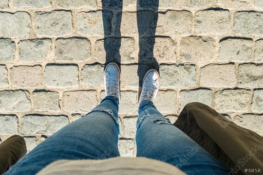 Young woman stands cobblestones, personal pespective from above.  : Stock Photo or Stock Video Download rcfotostock photos, images and assets rcfotostock | RC Photo Stock.: