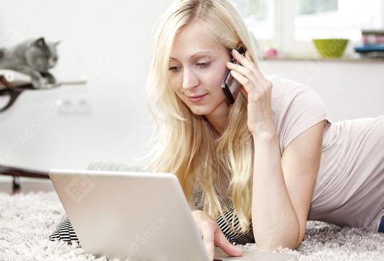 Young woman using Laptop and phone  : Stock Photo or Stock Video Download rcfotostock photos, images and assets rcfotostock | RC Photo Stock.: