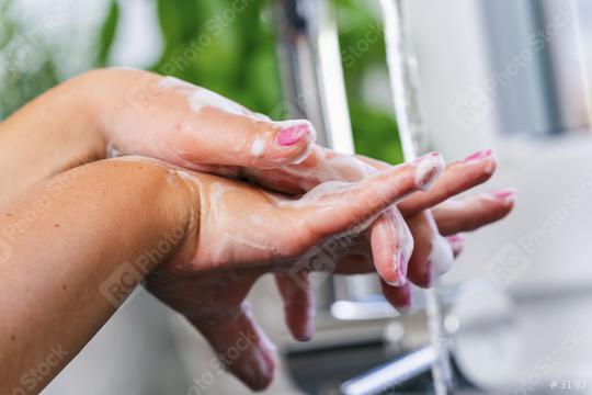 Young woman washing her hands  : Stock Photo or Stock Video Download rcfotostock photos, images and assets rcfotostock | RC Photo Stock.: