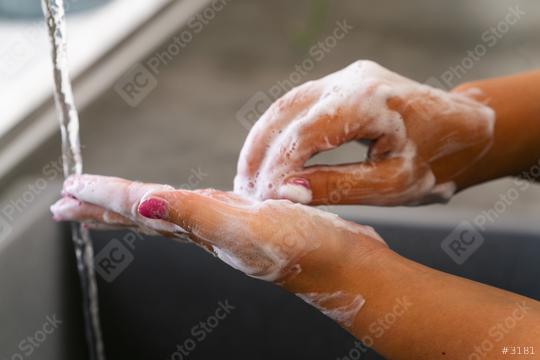 Young woman washing her hands under water with soap  : Stock Photo or Stock Video Download rcfotostock photos, images and assets rcfotostock | RC-Photo-Stock.: