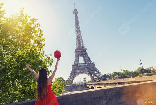 Young woman with red cap enjoying the great view on the Eiffel tower in Paris  : Stock Photo or Stock Video Download rcfotostock photos, images and assets rcfotostock | RC Photo Stock.: